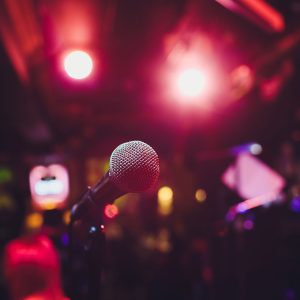 Microphone on stage against a background of auditorium